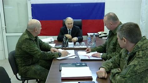 Putin visits military headquarters in Ukraine's Kherson region